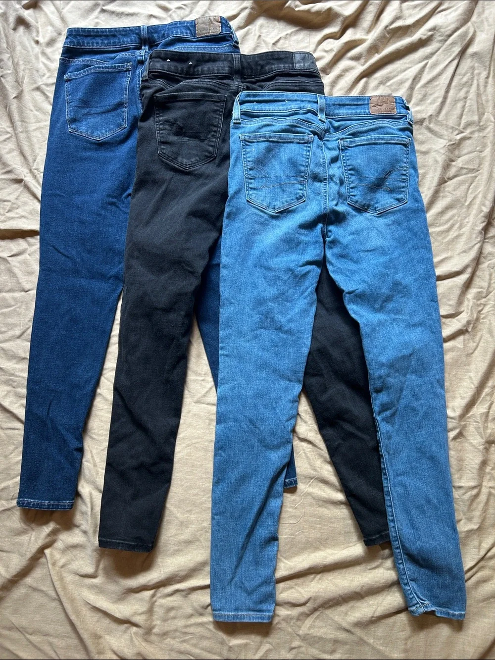 American Eagle Outfitters Skinny Jeans Trio in Dark Blue, Light Blue, and Black - Picture 1 of 7